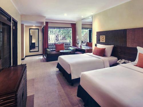 Postel nebo postele na pokoji v ubytování Mercure Resort Sanur