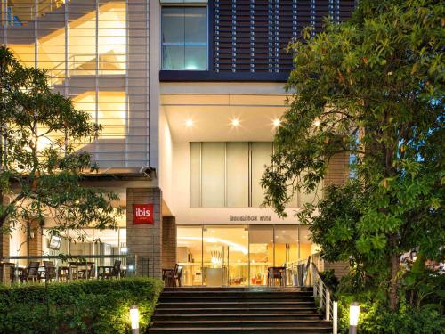 a building with stairs in front of it at ibis Bangkok Sathorn in Bangkok