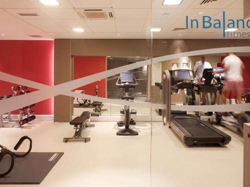 a store with a gym with people on machines at Novotel Liverpool Centre in Liverpool