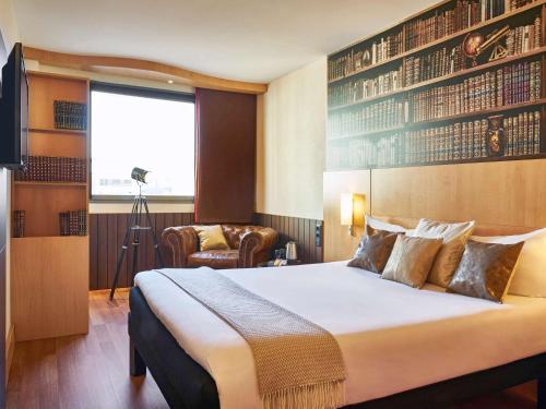 Llit o llits en una habitació de Ibis Barcelona Centro (Sagrada Familia)