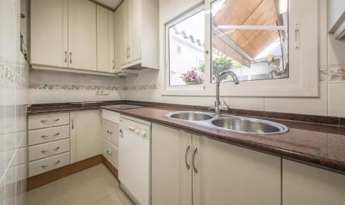 a kitchen with a sink and a window at Apartment Montserrat 11-1 in Calafell