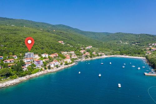 an aerial view of a beach with a red marker at House 61 Sveta Marina in Sveta Marina