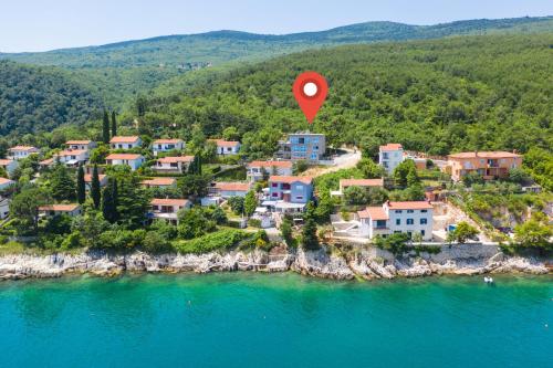 an aerial view of a small town on the water at House 61 Sveta Marina in Sveta Marina