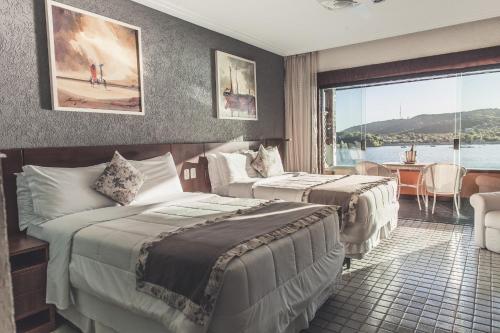 Ένα ή περισσότερα κρεβάτια σε δωμάτιο στο Hotel Ferradura Private