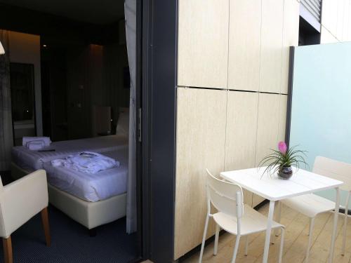 Un ou plusieurs lits dans un hébergement de l'établissement Ibis Styles Roma Eur