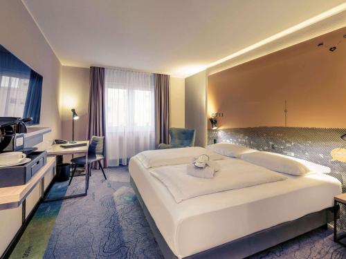 Ένα ή περισσότερα κρεβάτια σε δωμάτιο στο Mercure Stuttgart Zuffenhausen