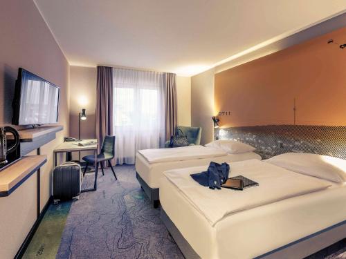 Ένα ή περισσότερα κρεβάτια σε δωμάτιο στο Mercure Stuttgart Zuffenhausen