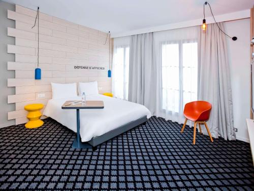 מיטה או מיטות בחדר ב-ibis Styles Chalons en Champagne Centre