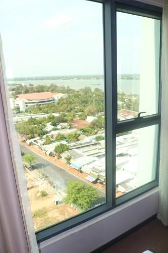 a view of a city from a window at Muong Thanh Luxury Can Tho Hotel in Can Tho