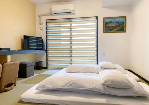 Krevet ili kreveti u jedinici u okviru objekta Villa Awase 111