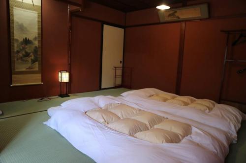 Ένα ή περισσότερα κρεβάτια σε δωμάτιο στο Yoshiki no Sato Dainichi no Yado