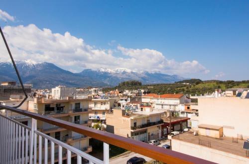a view from a balcony of a city with mountains at Laconian Collection Dorieon in Sparta