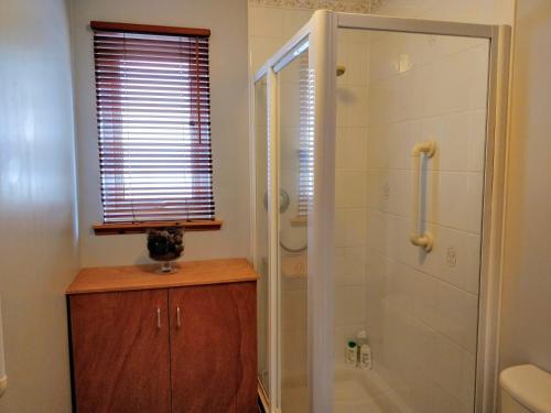 a bathroom with a shower and a glass shower stall at Holiday Accommodation Perth Scotland - Oakview in Perth