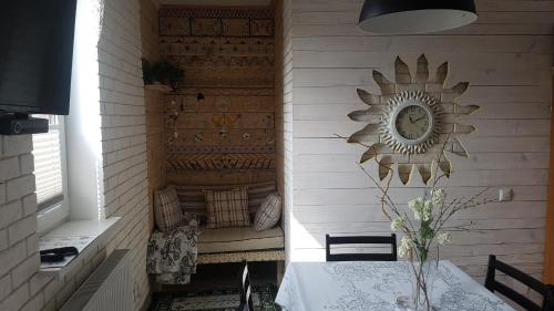 a room with a table and a mirror on a wall at Pryvitannya Sontsyu in Skhidnitsa
