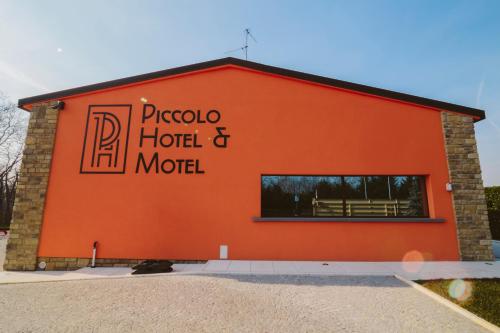 a building with the words pico hotel and motel on it at Piccolo Hotel in Palosco