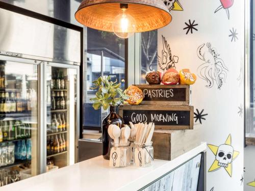 a counter in a store with a bottle of wine at ibis Sydney Barangaroo in Sydney