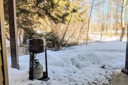 a fire hydrant is covered in snow at Beautiful Mountain Condo in Wilson