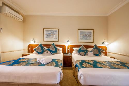 Katil atau katil-katil dalam bilik di Twin Towers Inn