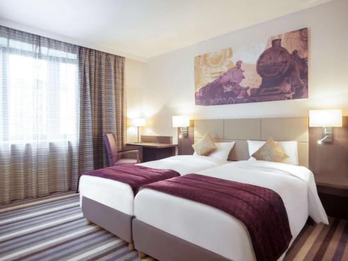 Кровать или кровати в номере Mercure Hotel Brussels Centre Midi