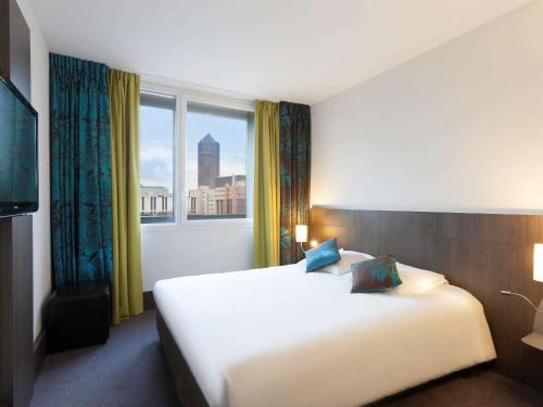 Postel nebo postele na pokoji v ubytování Ibis Styles Lyon Centre - Gare Part Dieu