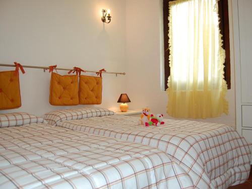 Säng eller sängar i ett rum på Appartamenti Brezza di Mare
