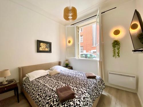 En eller flere senger på et rom på ARC DE TRIOMPHE-CARNOT Luxury & Design