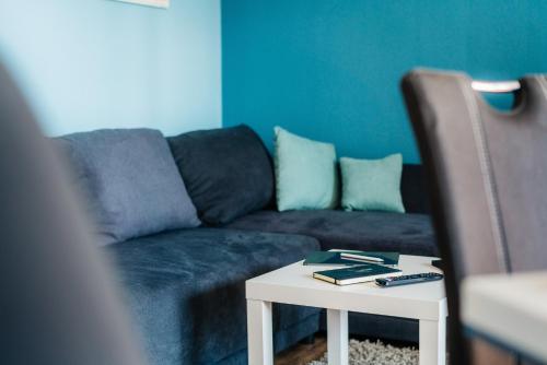 a living room with a couch and a table at Walpurgis Hexe in Braunlage