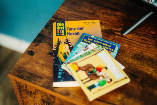 a table with two childrens books on a table at Walpurgis Hexe in Braunlage