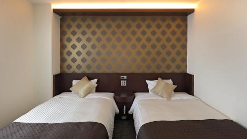 Ένα ή περισσότερα κρεβάτια σε δωμάτιο στο Hotel Annex Inn