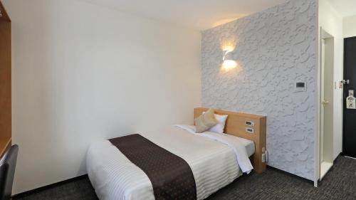 Ένα ή περισσότερα κρεβάτια σε δωμάτιο στο Hotel Annex Inn