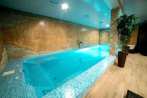 a large swimming pool in a building at Vila Prezident in Sremski Karlovci