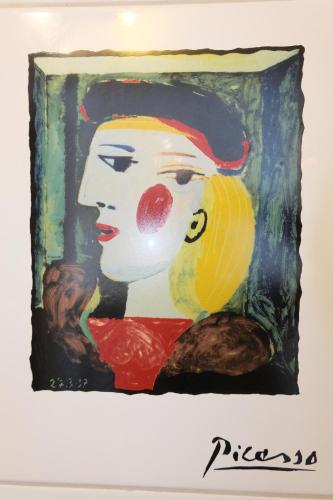 a painting of a woman with red lipstick at Artist Apartments & Hotel Garni in Zermatt