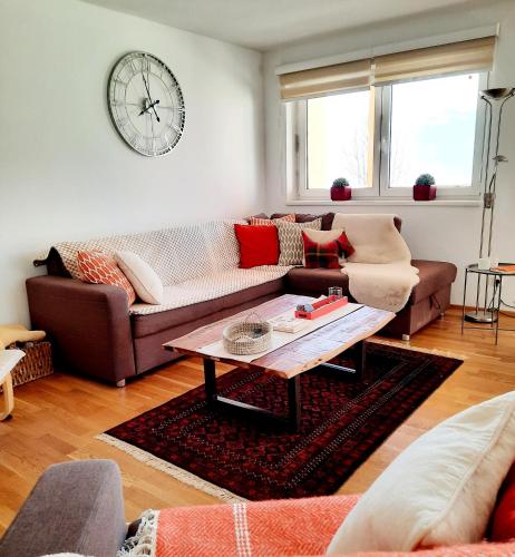 a living room with a couch and a coffee table at Piesendorf Pad - Oberbichl in Piesendorf