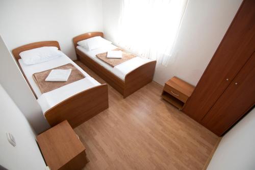 Postel nebo postele na pokoji v ubytování Apartmani Jurić