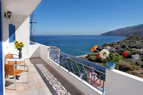 a balcony with a view of the ocean at Sea View Kerame in Évdhilos
