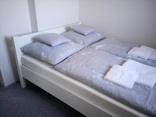 Postel nebo postele na pokoji v ubytování Apartamenty i pokoje Pluszak