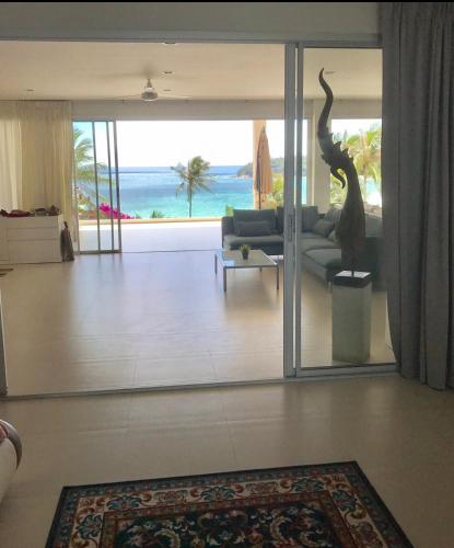 a living room with a view of the ocean at Kata Top Villas in Kata Beach