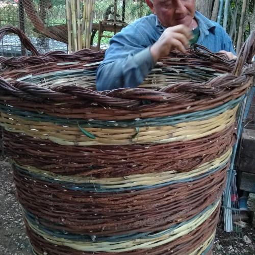 a man sitting inside of a large basket at Petalo Rosso b&b in Lenola