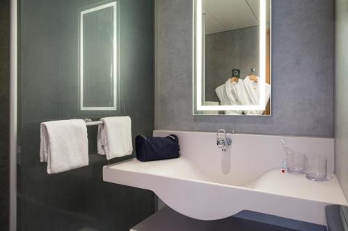 Koupelna v ubytování Novotel Lausanne Bussigny