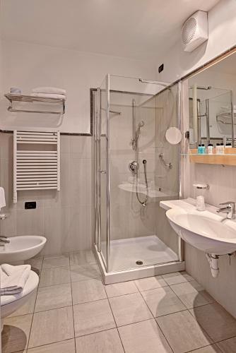 a bathroom with a shower and a sink at Aregai Marina Hotel & Residence in Santo Stefano al Mare