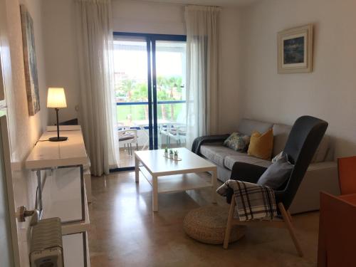 a living room with a couch and a table at Albir Azul in Albir