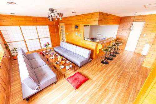 a living room with a couch and a table at The OASIS in Sapporo