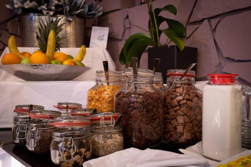 a table with jars of nuts and other foods at Anor Hotel & Conference Center Frankfurt Airport in Mörfelden-Walldorf