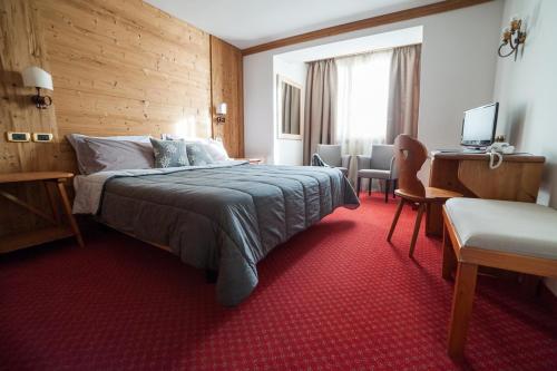 Кровать или кровати в номере Hotel Vecchia Stazione Mountain Elegance