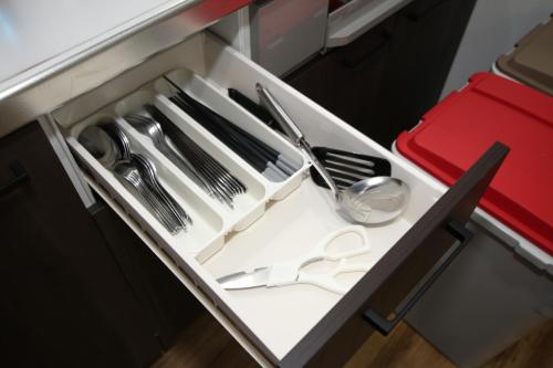 a drawer in a kitchen with utensils at Tiz wan 岩屋あわじ in Awaji