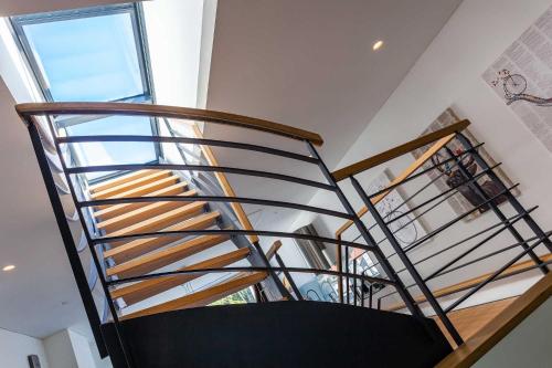 a spiral staircase in a house with a window at Villa Baltic Pearl Penthouse in Ostseebad Sellin