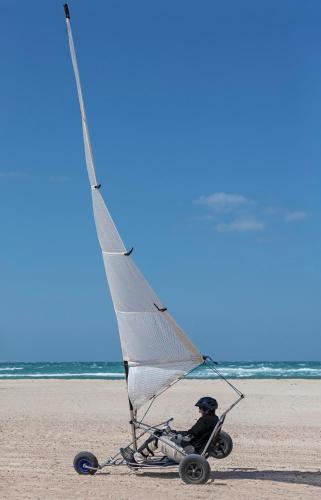 a small sail boat on the beach at Anantara Sir Bani Yas Island Al Yamm Villa Resort in Da‘sah
