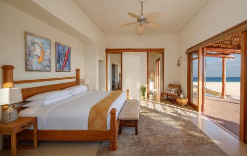 A bed or beds in a room at Anantara Sir Bani Yas Island Al Yamm Villa Resort