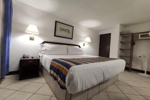 Hotel Del Portal, Pueblaにあるベッド