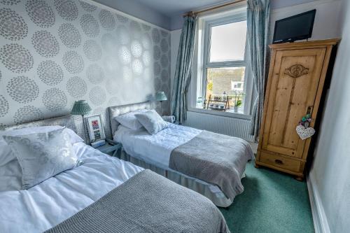 Säng eller sängar i ett rum på Craiglands Bed and Breakfast, Grassington